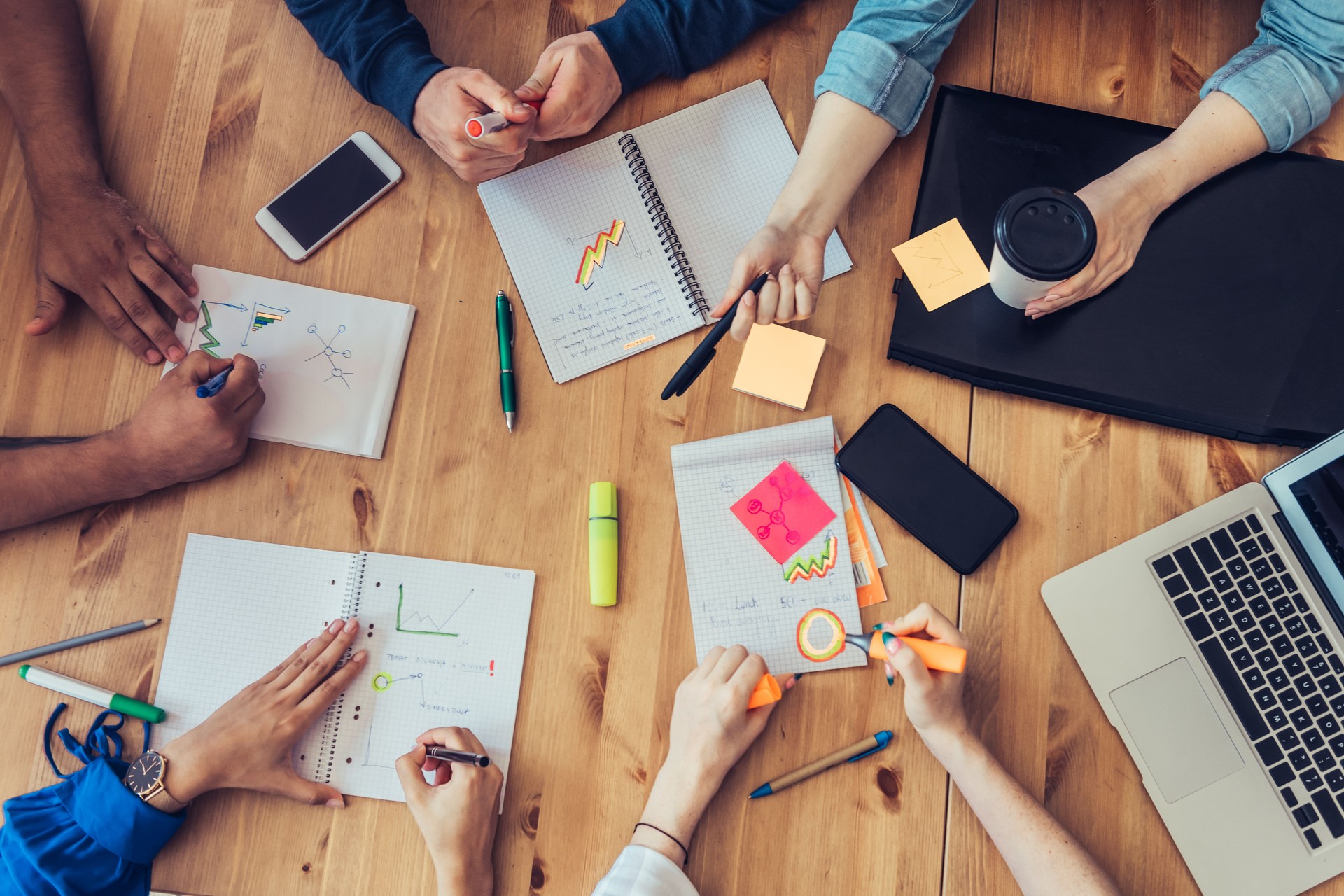 overhead view on business people around desk