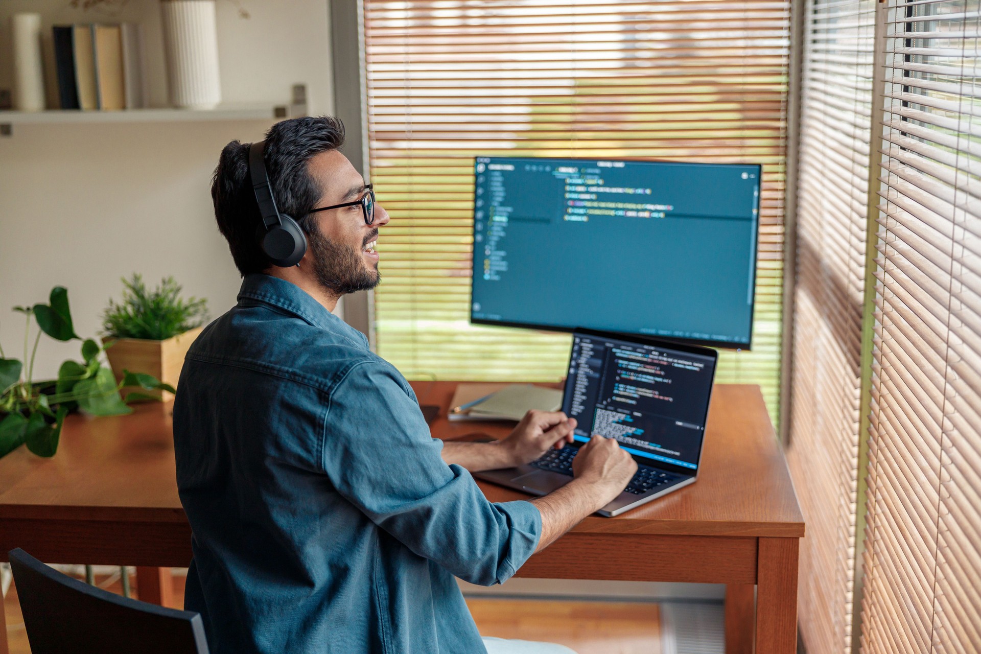 Male freelancer making new project as web designer or programmer on his computer at home office